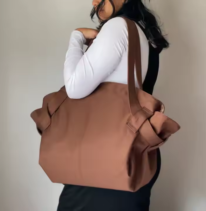 fleurissaint bag Spacious, stylish, and built for every journey  the Fleurissaint bag is your go-everywhere essential. whether you're headed to the beach, catching a flight, or running errands in the city, this versatile tote combines fashion and function